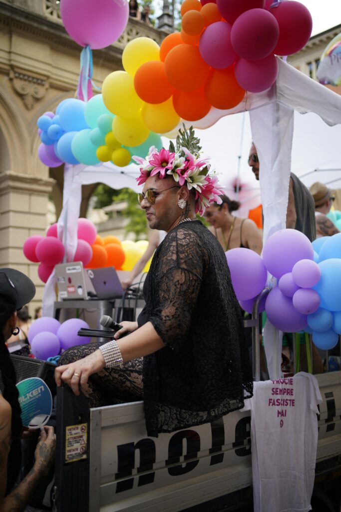 A Person Riding a Gay Showboat i a Parade